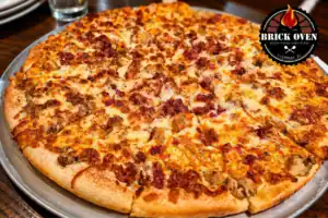Large cheese and meat pizza served on a tray in a restaurant